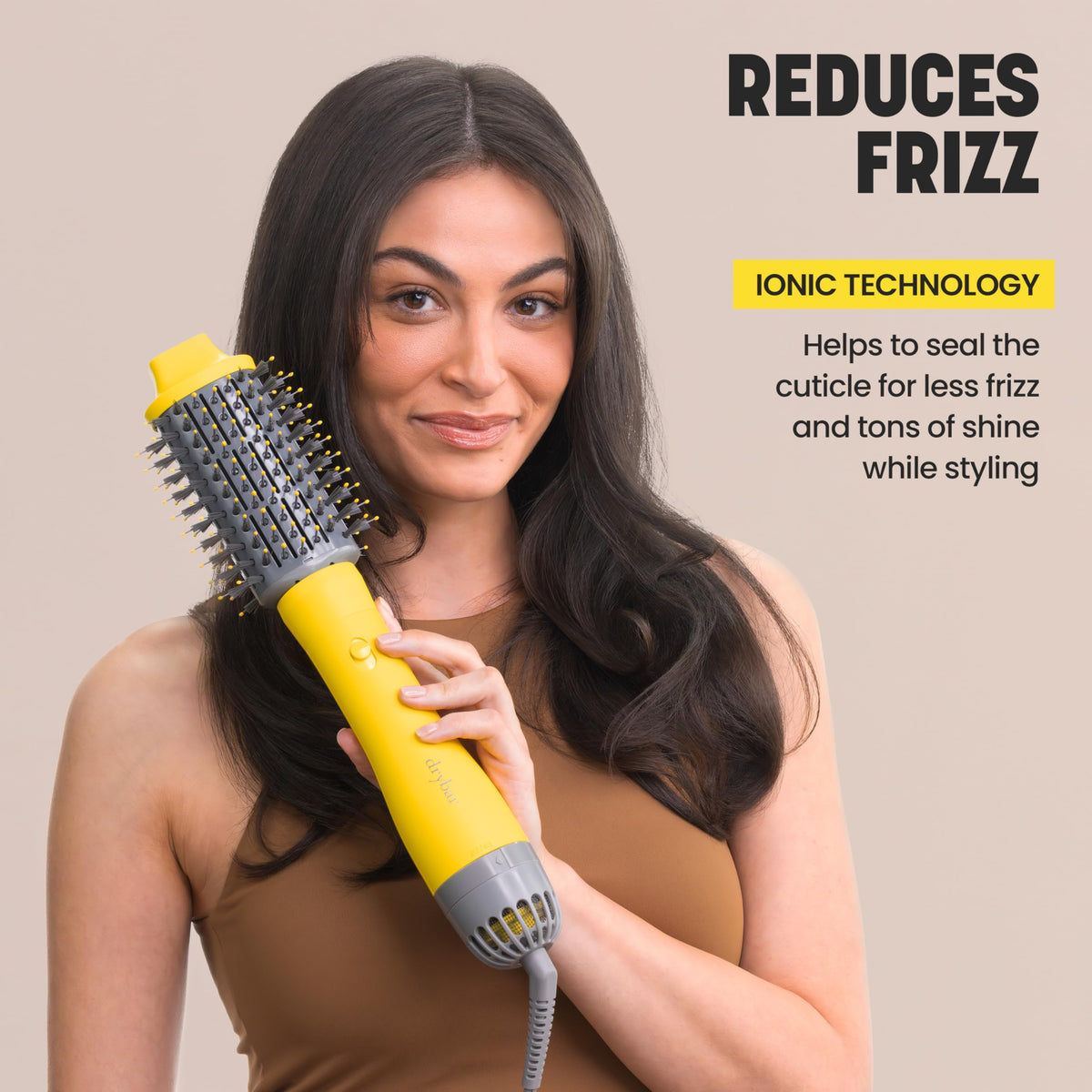 Drybar Triple Shot styling a model for a voluminous salon blowout in use