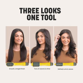 Drybar Triple Shot held in hand to show compact size and ergonomic grip