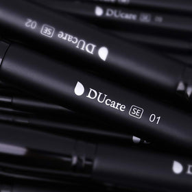 DUcare brushes in use applying foundation on model for seamless, professional finish