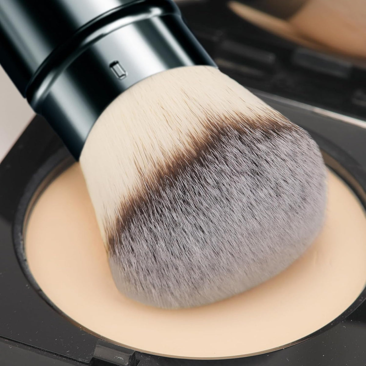 DUcare size comparison next to lipstick demonstrating compact, portable scale