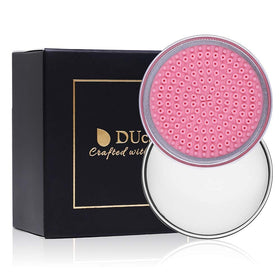 DUcare soap next to makeup sponges showing gentle stain removal and conditioning