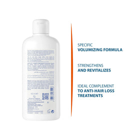 Ducray Anaphase+ bottle held in hand for size reference and travel convenience