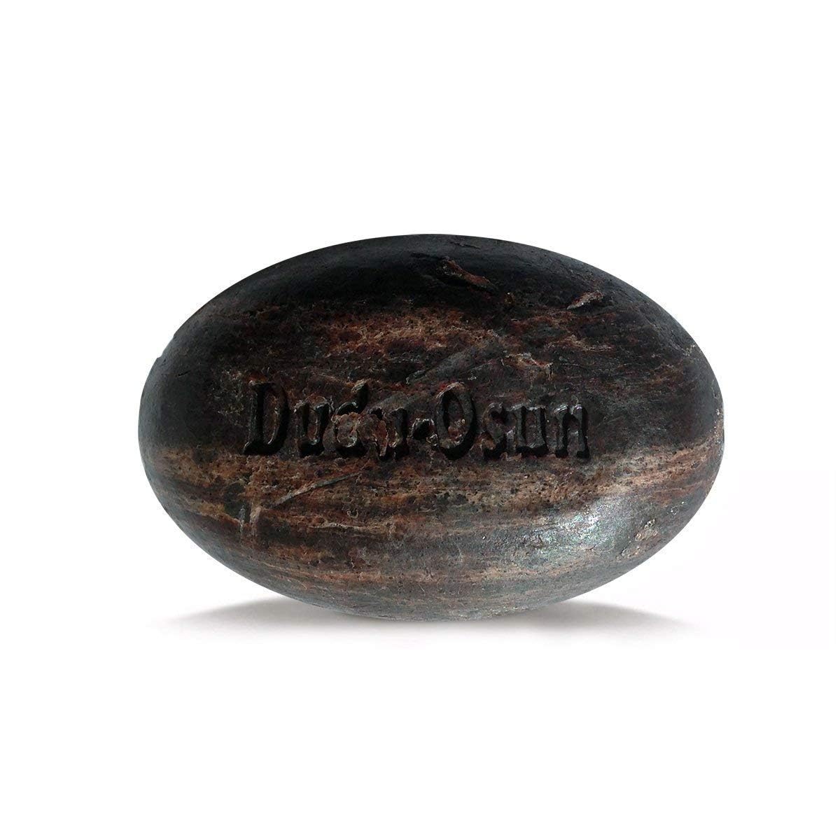Dudu-Osun bar in hand creating a creamy lather demonstrating gentle deep-clean benefit