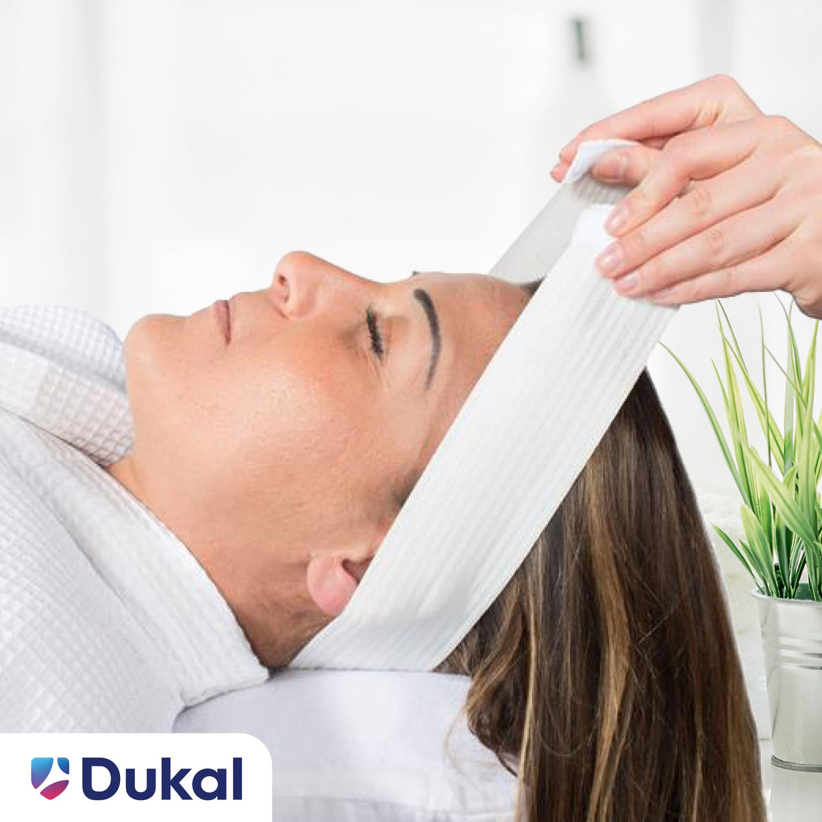 Dukal headband in use during spa facial, keeps hair neatly away