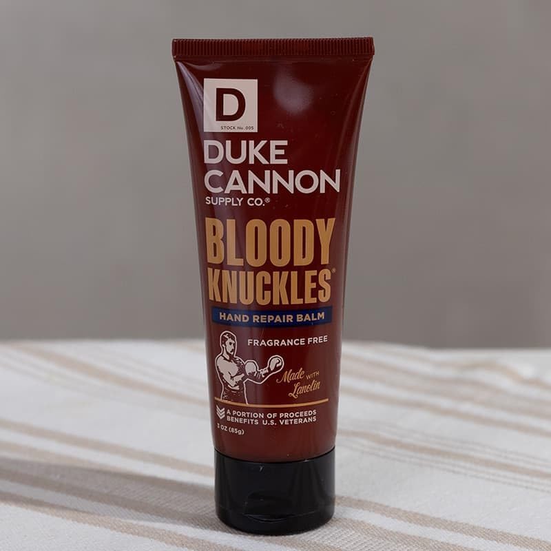 Duke Cannon balm being applied to rough hands for fast soothing relief