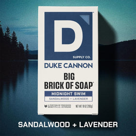 Duke Cannon bar in hand displaying large 10 oz size for long-lasting use