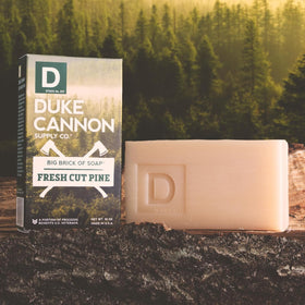 Duke Cannon lathering bar in shower, displays rich lather for full-body cleansing