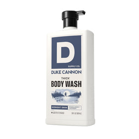 30 fl oz Duke Cannon bottle next to hand demonstrating size and long‑lasting benefit