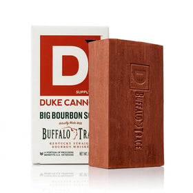 Duke Cannon soap next to a standard bar showing size comparison and extended value