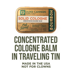 Duke Cannon bourbon solid cologne tin in hand showing compact travel size
