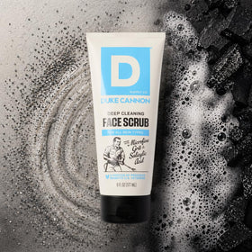 Duke Cannon face scrub on bathroom shelf paired with grooming items for routine