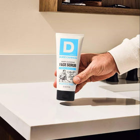 Duke Cannon scrub texture close-up revealing microfine grit and exfoliating action