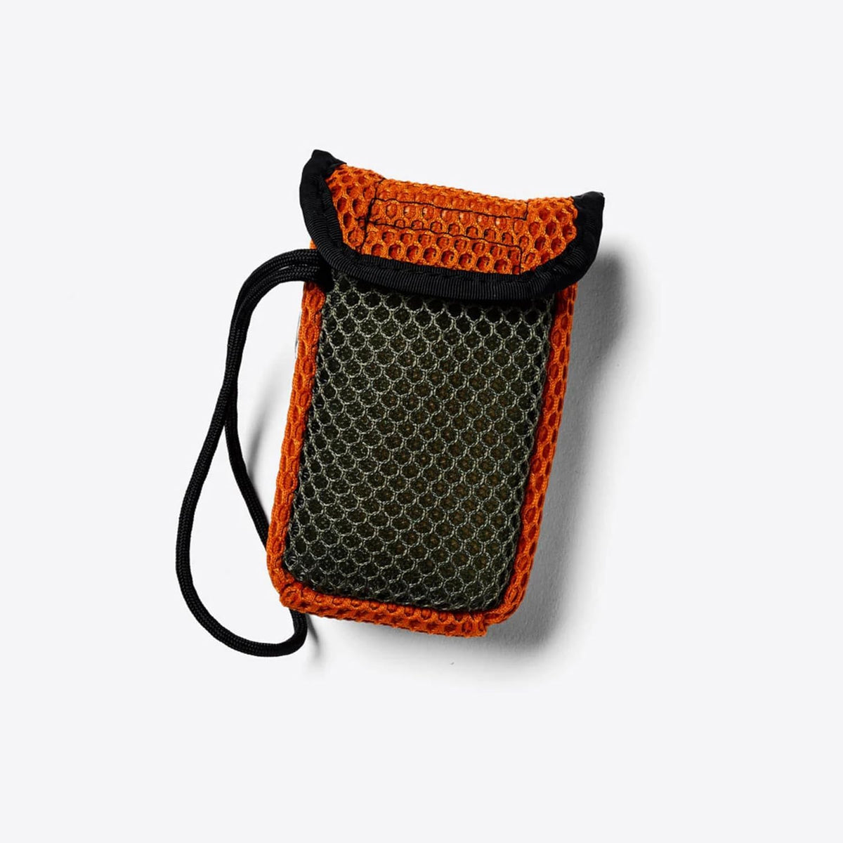 Duke Cannon scrubber hanging in outdoor shower demonstrating travel and camp use