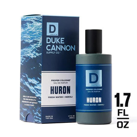 Duke Cannon bottle outdoors by a lake to evoke fresh, open-water inspiration