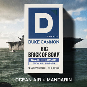 Duke Cannon soap in hand to show 10 oz scale and long-lasting size benefit