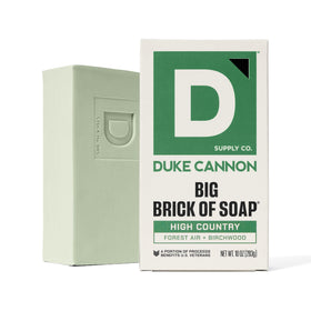 Duke Cannon bar used in outdoor shower, outdoors-ready freshness benefit