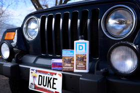 Duke Cannon in shower with outdoor gear conveying rugged scent and everyday reliability