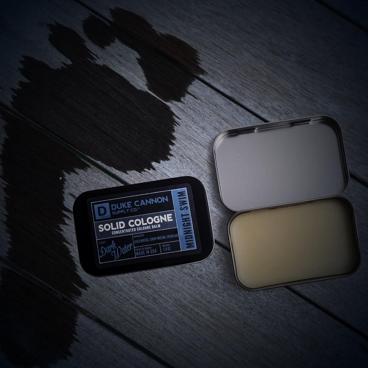 Duke Cannon tin on a nightstand suggesting evening-ready modern scent