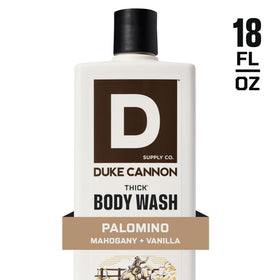 Duke Cannon bottle next to hand for scale showing 18 oz value and longevity