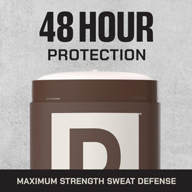 Duke Cannon stick beside gym gear illustrating long-lasting protection during workouts and active days