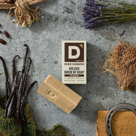 Duke Cannon label close-up showing scent and natural oils info