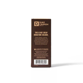Duke Cannon Palomino beside a coin showing 1.7 fl oz scale for portability