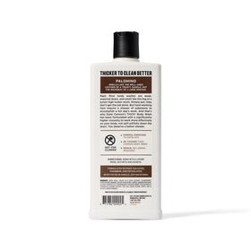 Duke Cannon bottle on shower shelf indicating durable packaging and easy reach