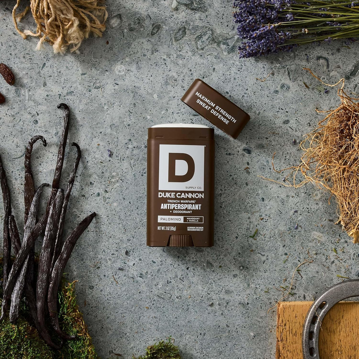 Duke Cannon deodorant stick held in hand showing ease of use and travel-ready, reliable sweat defense