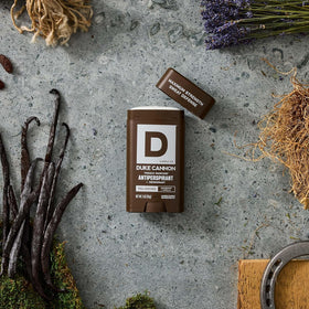 Duke Cannon deodorant stick held in hand showing ease of use and travel-ready, reliable sweat defense