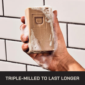Duke Cannon soap on shower shelf demonstrating easy daily use