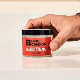 Duke Cannon open jar close-up of pomade texture highlighting easy application and matte finish