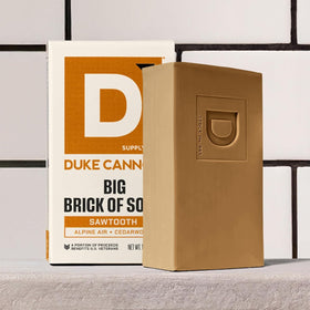 Duke Cannon Sawtooth beside razor indicating practical grooming companion