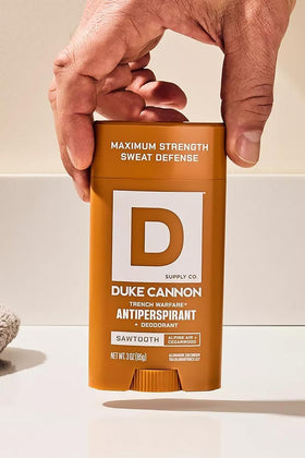 Duke Cannon visual of cedar and pine elements showing scent profile benefit
