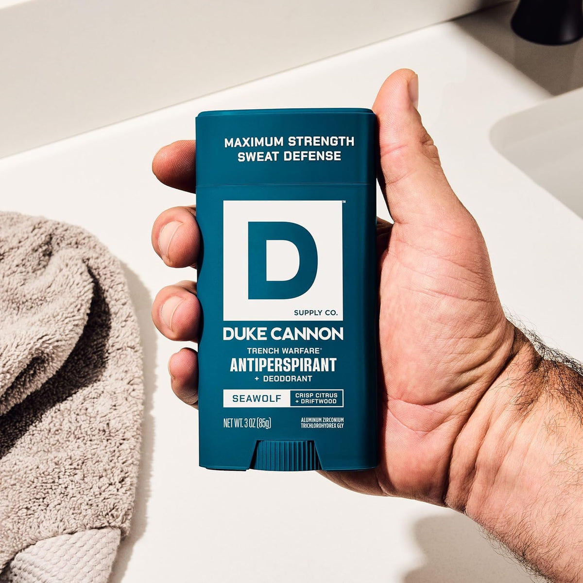 3 oz Duke Cannon Seawolf next to travel items showing compact grooming convenience