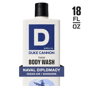 Duke Cannon bottle next to ruler showing 18 oz size and value