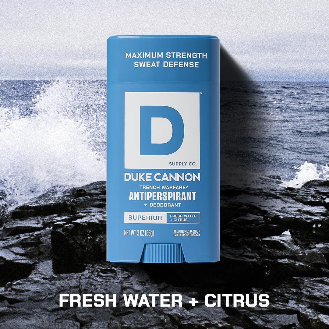 Duke Cannon next to a smartphone to show compact size