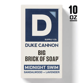 Duke Cannon soap on draining dish in shower promoting faster dry time and longer life