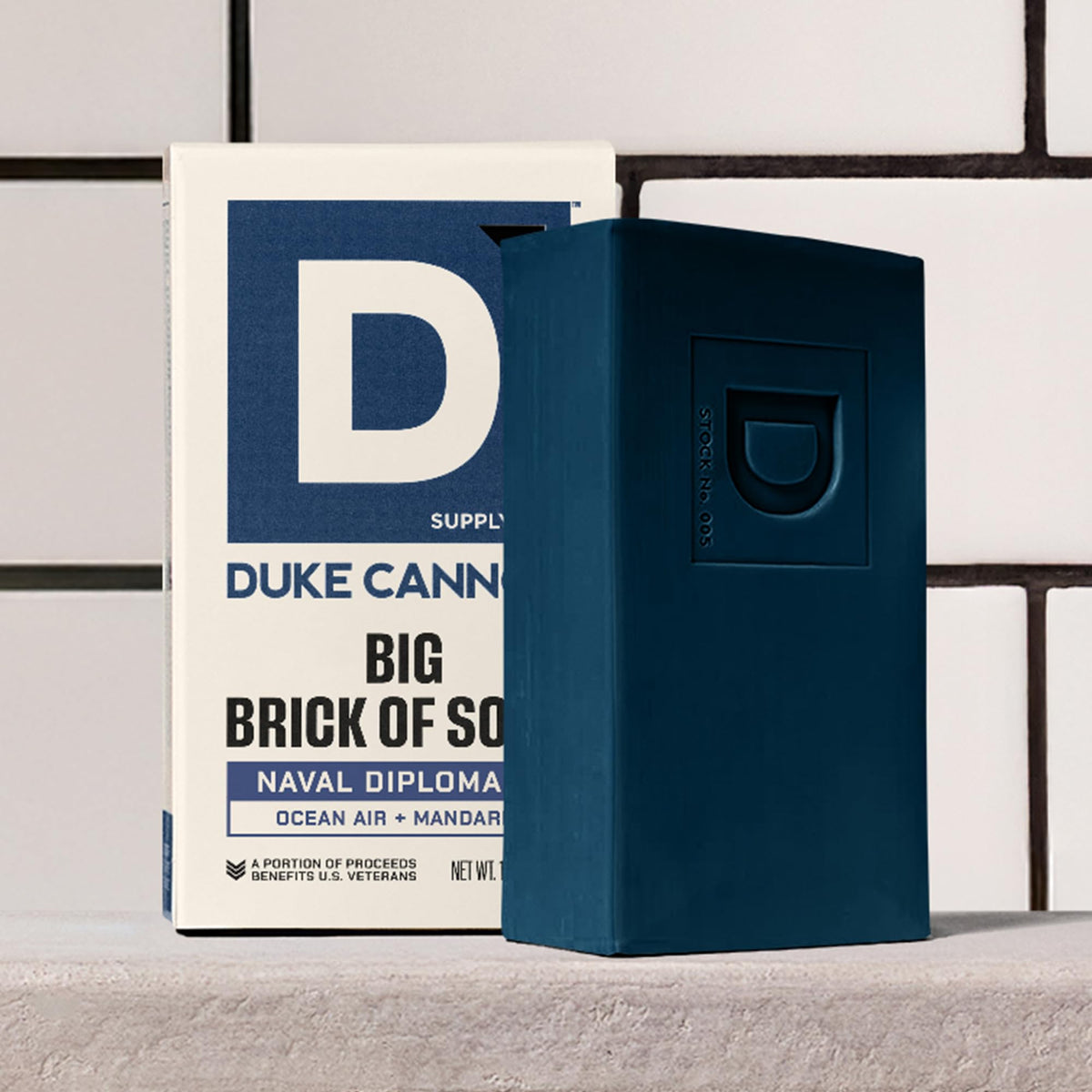 Duke Cannon soap in travel case suggesting portability and reliable grooming on trips