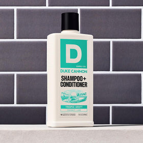 Duke Cannon bottle with open cap and lather for quick convenient wash