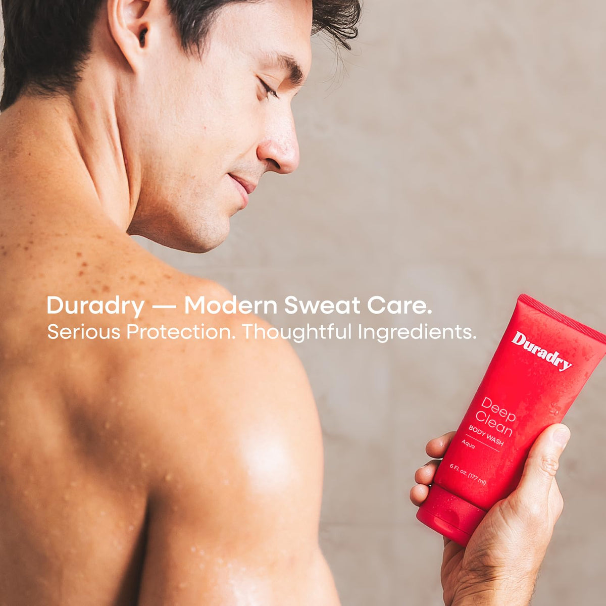 Duradry bottle in hand for size comparison, showing compact travel-friendly benefit