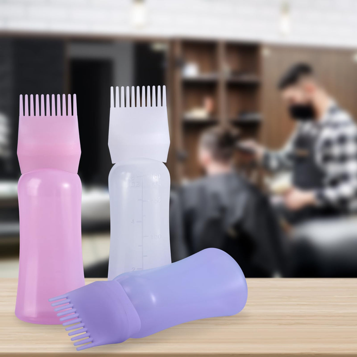 Dymoece bottle held in hand to show 6 ounce size and portability