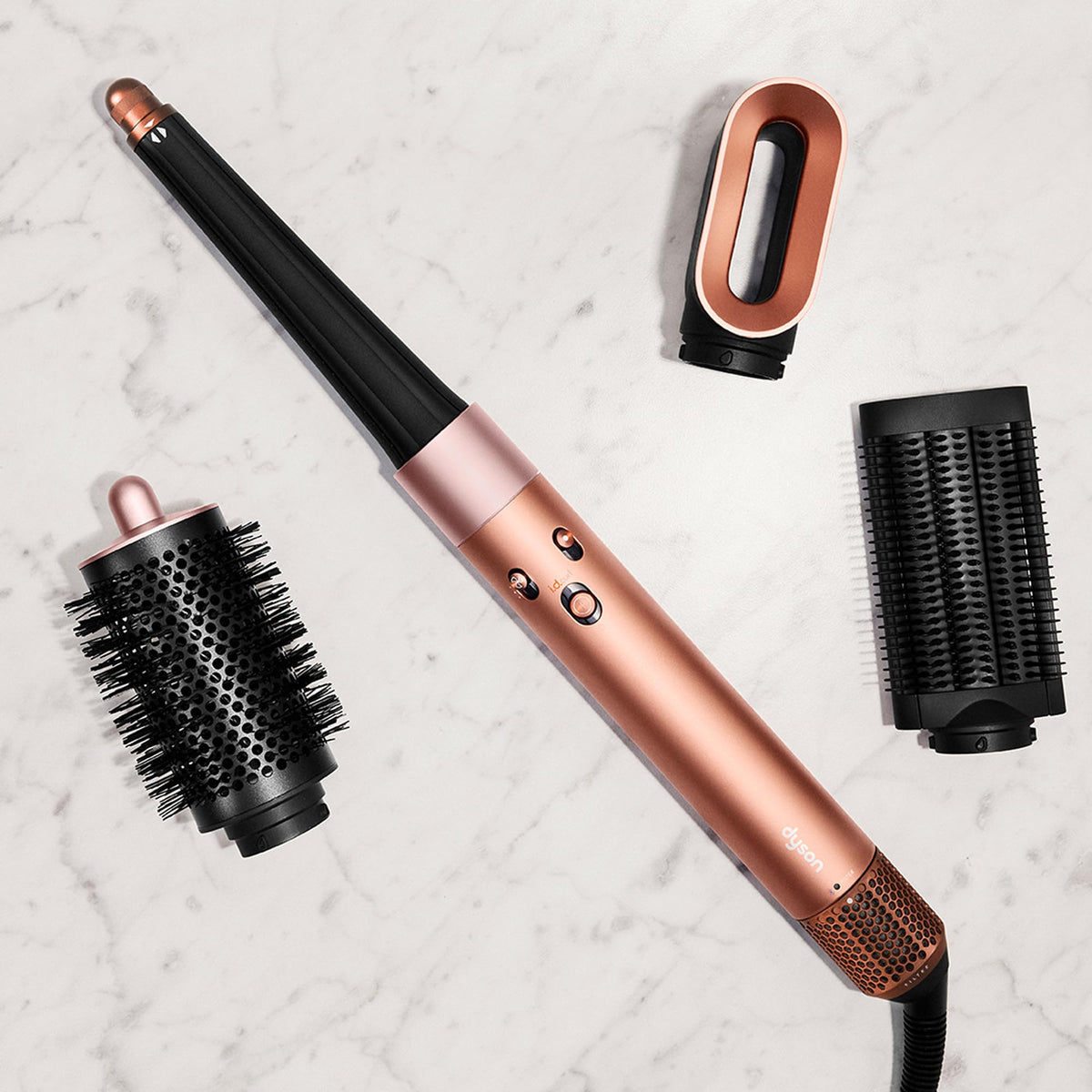 Model using Dyson Airwrap i.d. to curl hair showcasing effortless heat‑free shaping