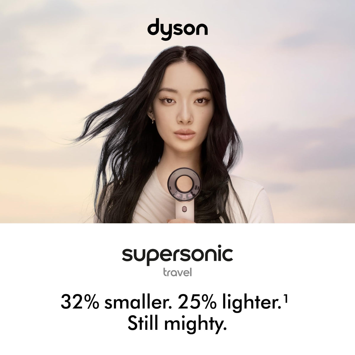 Dyson Supersonic Travel beside passport showing compact size and easy packing