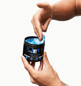 E Elegance gel in hand being applied to hair demonstrating controlled strong hold benefit