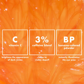 e.l.f. cream on fingertips ready to pat for targeted under-eye depuffing