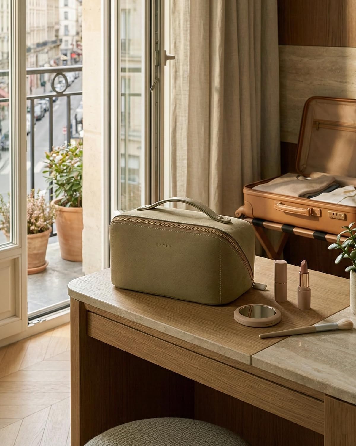 eachy inside an open suitcase, organizes toiletries for travel