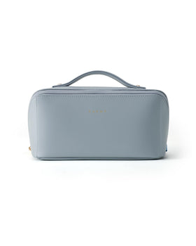 EACHY bag held in hand to show compact 9.2 x 4.3 x 4.6 inch size and everyday convenience
