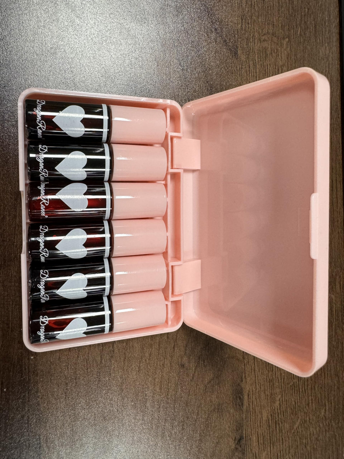 Eakroo tubes inside purse to show portable on-the-go beauty benefit