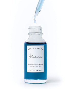 Earth Harbor MARINA ampoule dropper releasing serum, demonstrating controlled, hygienic application