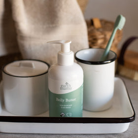 Earth Mama jar on vanity illustrating everyday pregnancy skincare